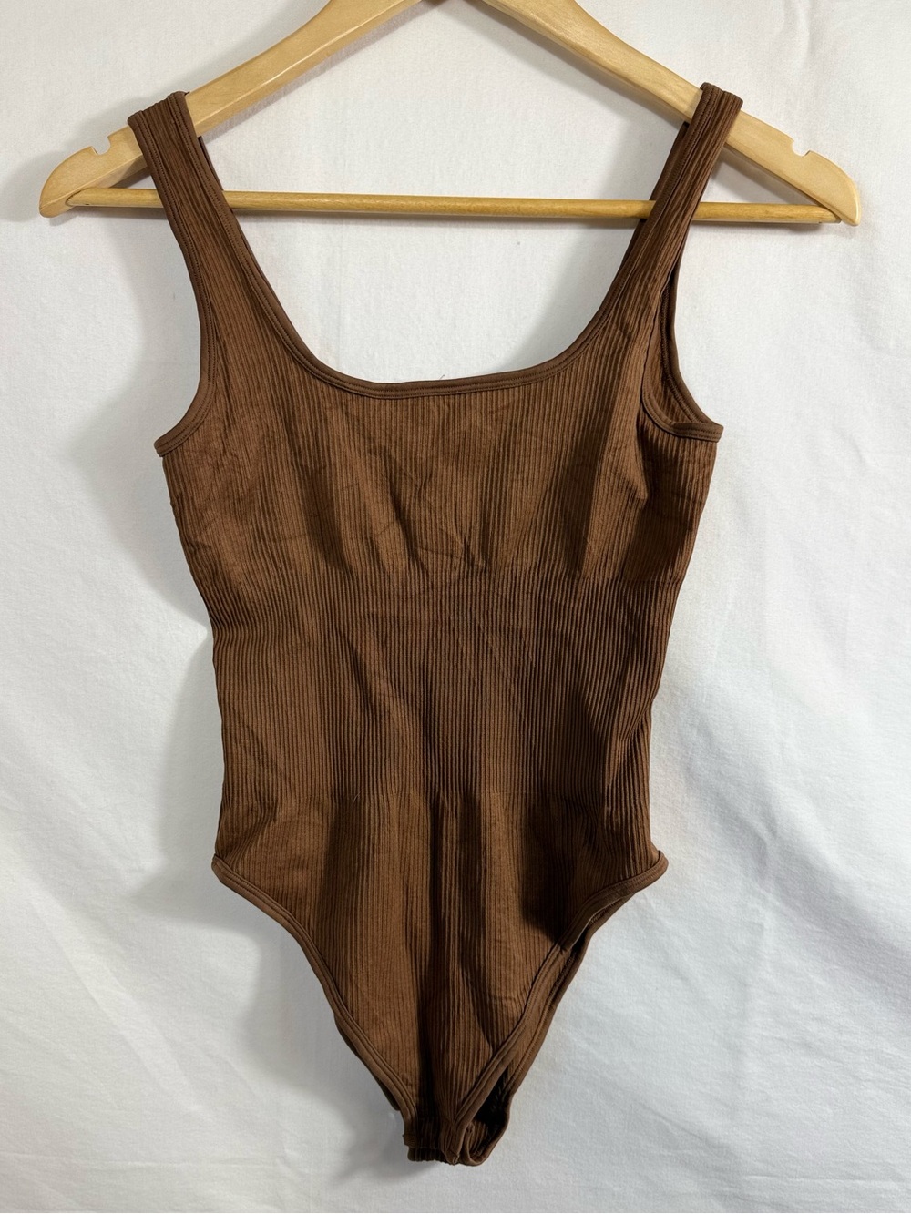 OQQ Ribbed Sleeveless Square Neck Bodysuit in the shade "Coffee"